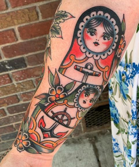 Amazing-Matryoshka-Arm-Tattoo-with-Anchors
