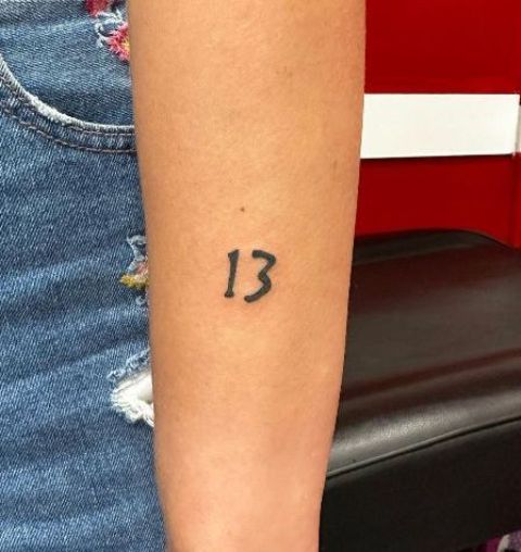 Lovely-Minimal-Back-of-Arm-Lucky-13-Tattoo 