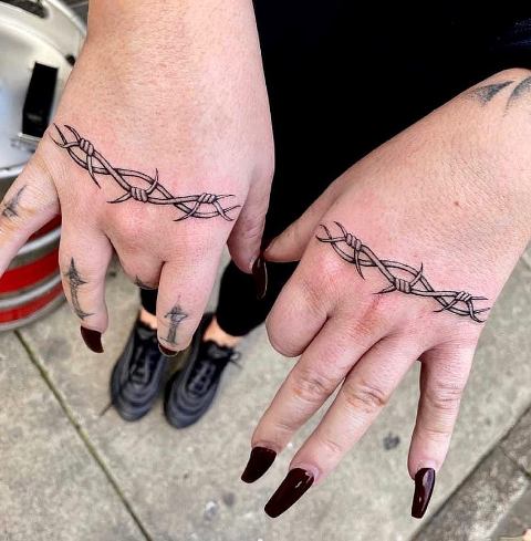 Attractive-Barbed-Wire-Tattoo-on-Hand
